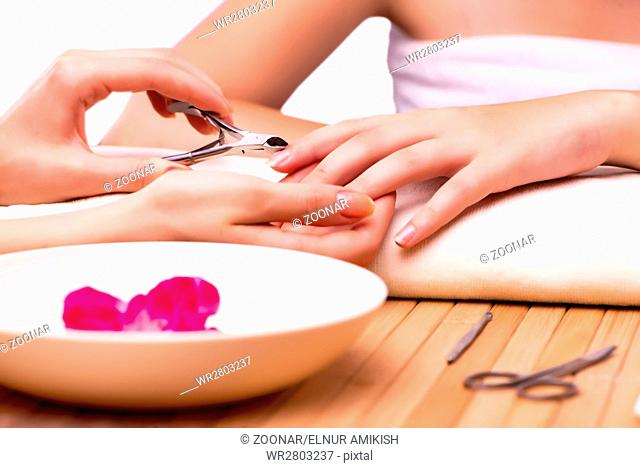 Young woman in nail treatment medical concept
