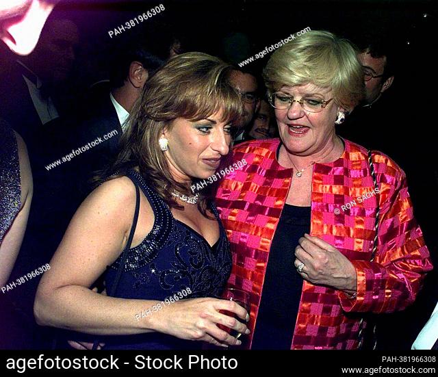 Paula Jones meets Lucianne Goldberg during one of the parties following the White House Correspondents Dinner in Washington, DC on April 25, 1998