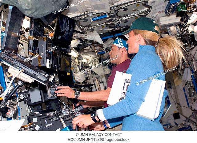 Astronaut Karen Nyberg and Japan Aerospace Exploration Agency (JAXA) astronaut Akihiko Hoshide, both STS-124 mission specialists