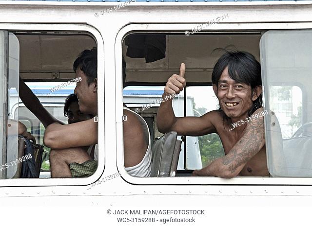 man smiling on yangon myanmar bus burma
