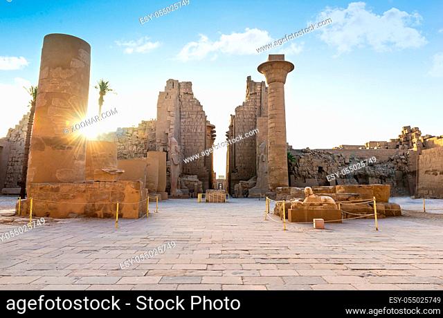 Ruins and statues of Karnak temple in Luxor at sunrise, Egypt
