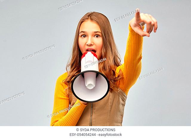 teenage girl speaking to megaphone
