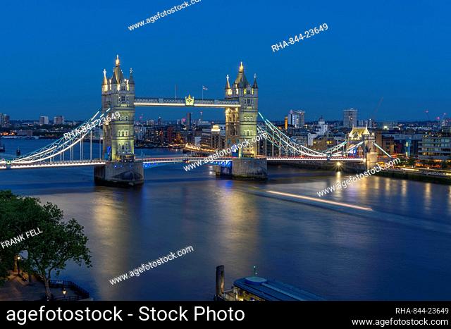View of Tower Bridge and River Thames from Cheval Three Quays at dusk, London, England, United Kingdom, Europe