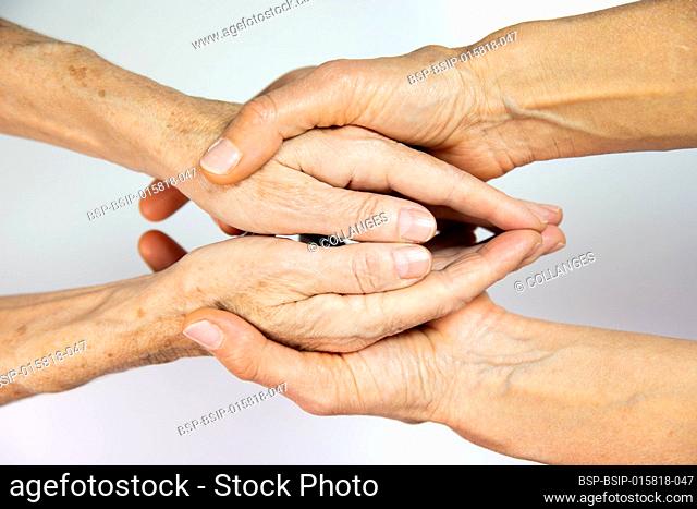 An elderly woman and young woman’s hands