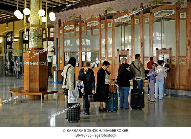 Travellers queueing in the lobby in front of ticket counters, main station, Valencia, Spain
