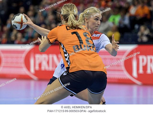 Norway's Stine Bredal Oftedal (back) and the Netherlands' Kelly Dulfer vying for the ball during the 2017 World Women's Handball Championship semi-final match...