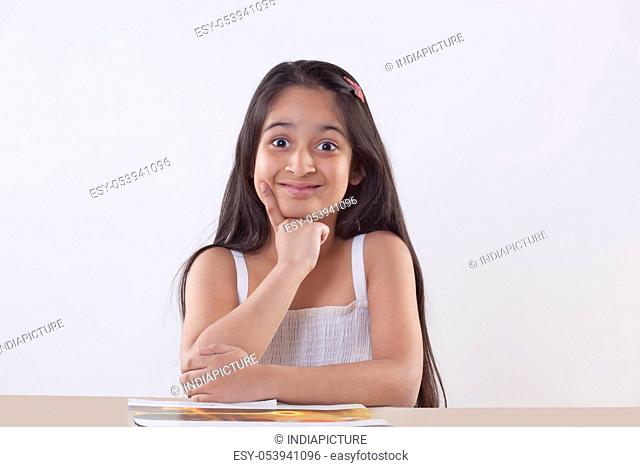 Portrait of a little girl with an idea