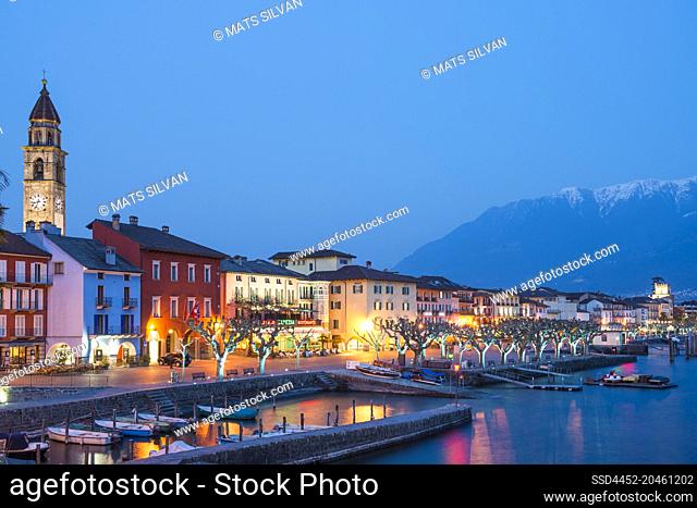 Village Ascona at Night with Mountain and Alpine lake Maggiore in Ticino, Switzerland