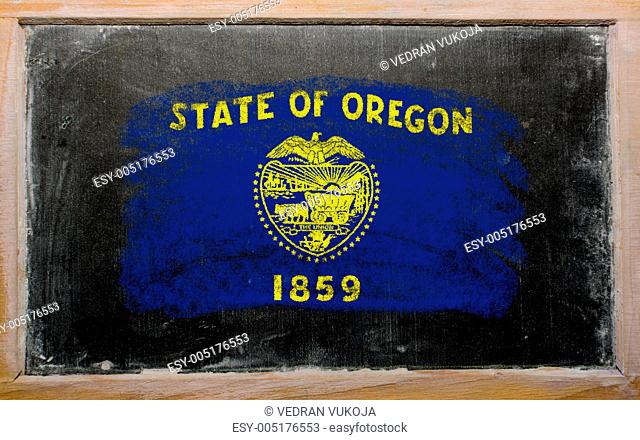 flag of US state of oregon on blackboard painted with chalk