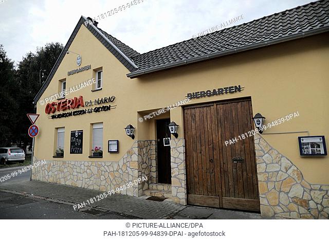 05 December 2018, North Rhine-Westphalia, Pulheim: The shutters at an Osteria are locked. During the large-scale raid against the Italian Mafia