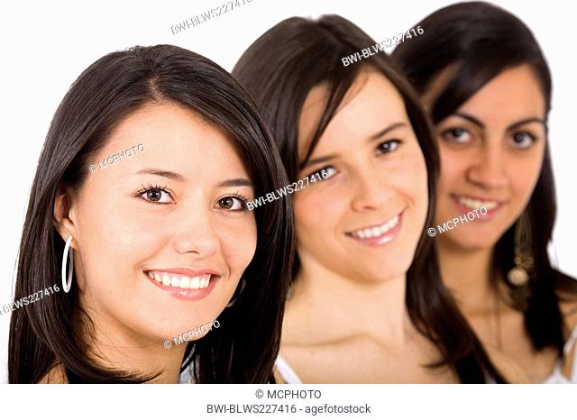 three smiling young women with long straight dark brown hair in a row