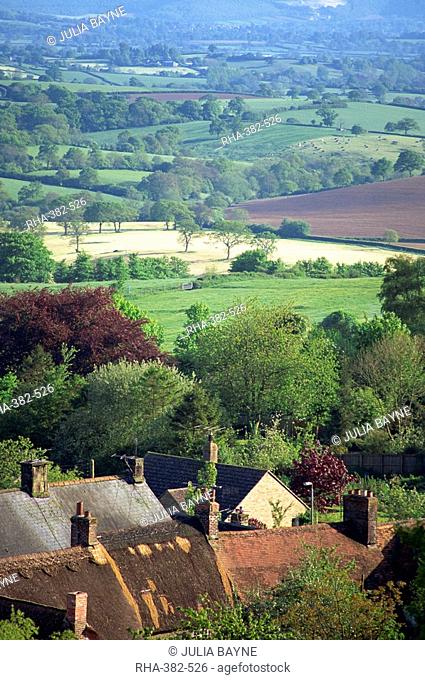 Roofs of houses in Shaftesbury and typical patchwork fields beyond, Dorset, England, United Kingdom, Europe