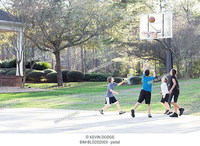 Boys playing basketball