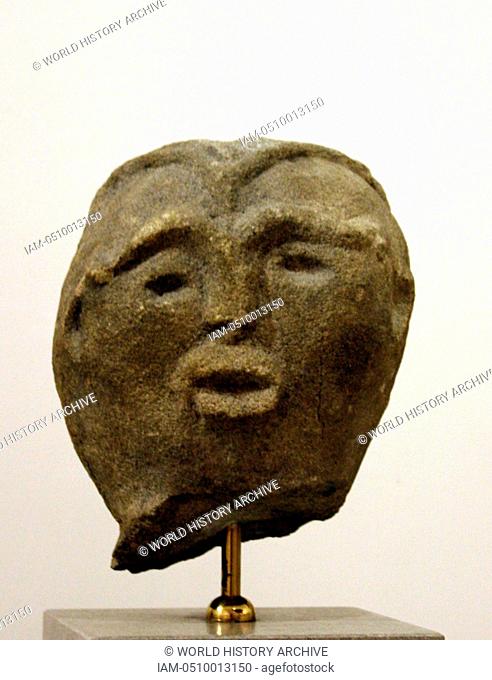 Male head carved in volcanic stone. From Lemnos, 19th century BC, Architectural relief, possibly of apotropaic character