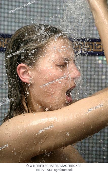Woman standing in the shower
