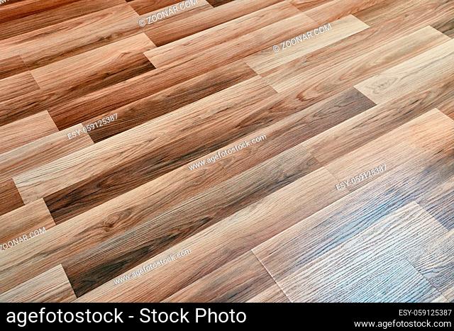 Shiny clean wooden floor reflecting light