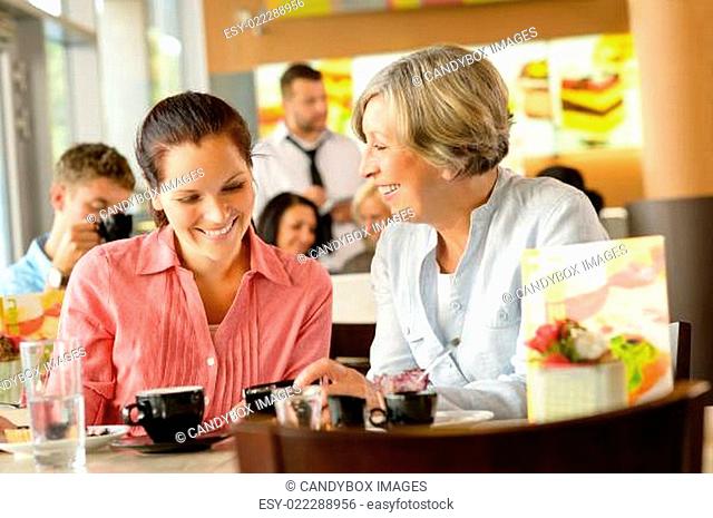 Mother and daughter relaxing in a cafe