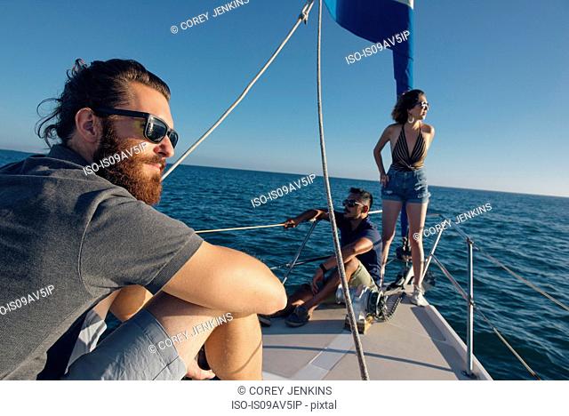 Friends enjoying view on sailboat, San Diego Bay, California, USA