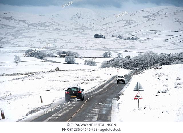 Traffic on road in snowy weather conditions, A683 between Kirkby Stephen and Sedbergh, Cumbria, England, December