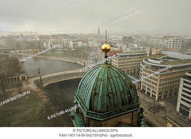 14 January 2019, Berlin: The view from the Berlin Cathedral in Berlin Mitte. The wet roofs of the capital reflect the sunlight