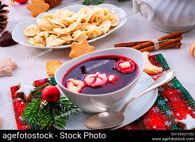 Barszcz (beetroot soup) with small pierogi