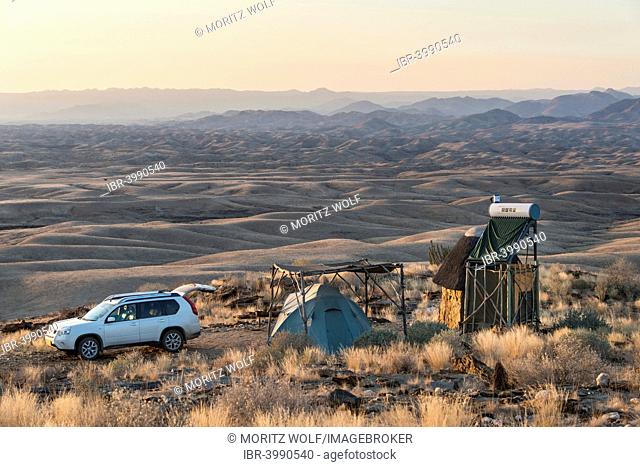 SUV next to tent and small hut, Valle de la luna, Namib Naukluft, Namibia