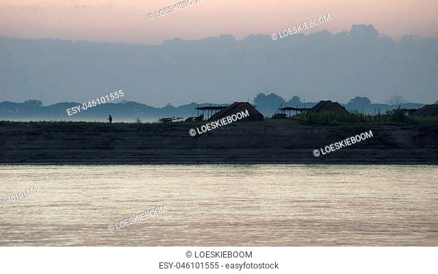 huts in village along the riverside of Irrawaddy, Myanmar