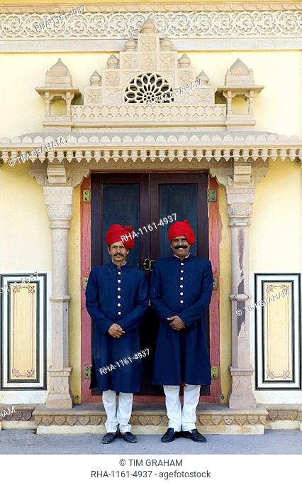Palace guards in achkan suit at former Royal Guest House now a textile museum in the Maharaja's Moon Palace in Jaipur, Rajasthan, India