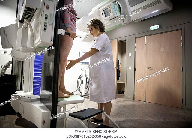 Reportage in a radiology centre in Haute-Savoie, France. A patient with a knee prosthesis has a check-up x-ray