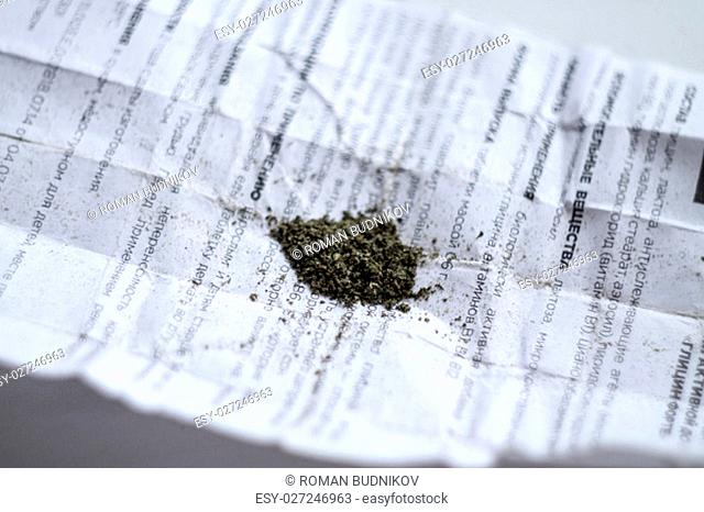 marijuana on white newspaper ready to use