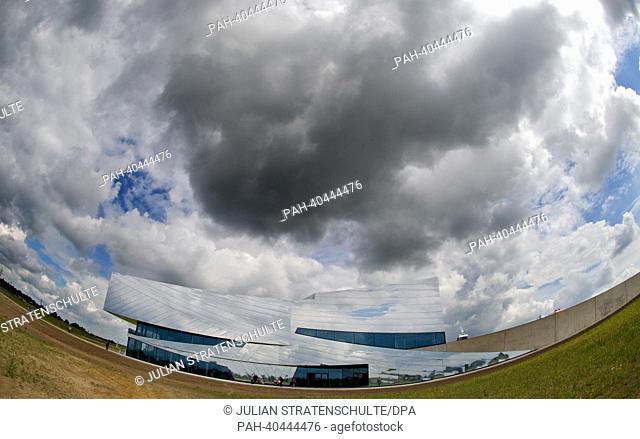 Clouds pass over the Exhibit and Research Centre Palaeon in Schoeningen, Germany, 24 June 2013. The 15 million euro project was officially opened on 24 June...