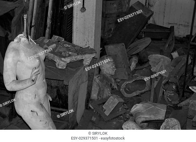 ATHENS - JANUARY 15: Broken statue of nude female figure among vandalized sculptures in the abandoned studio of artist Nikolaos Pavlopoulos (1909 - 1990)