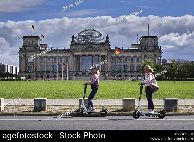Germany, Berlin, 27. 08. 2020, Reichstag building, German Bundestag, meadow Platz der Republik, electric scooter, Europe