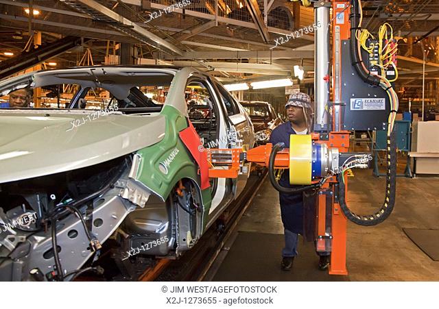 Detroit, Michigan - A worker installs the instrument panel in a Chevrolet Volt at General Motors' Detroit-Hamtramck Assembly Plant  The Volt is powered by...