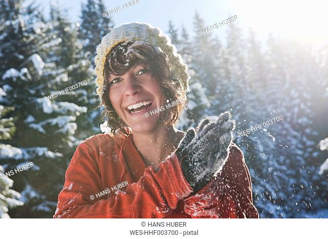 Austria, Salzburg Country, Flachau, Young woman having fun in snow