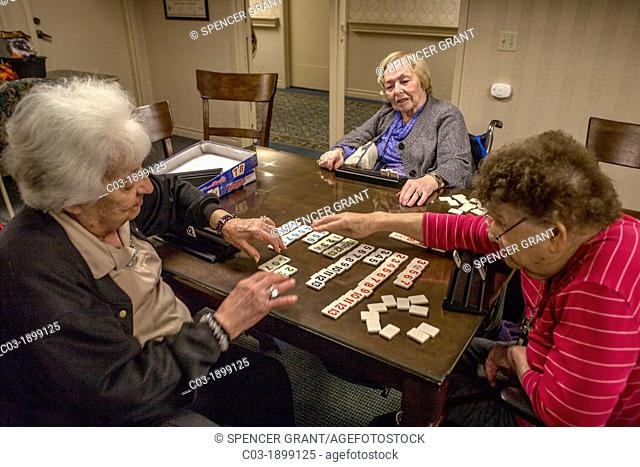 Elderly residents at a retirement home in Mission Viejo, CA, play a board numbers game
