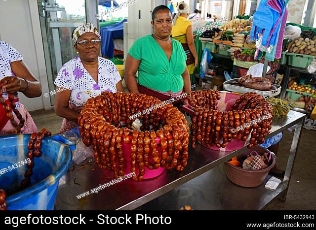 Market woman at the sausage stand, market hall, Plato, Praia, Santiago Island, Cape Verde, Africa