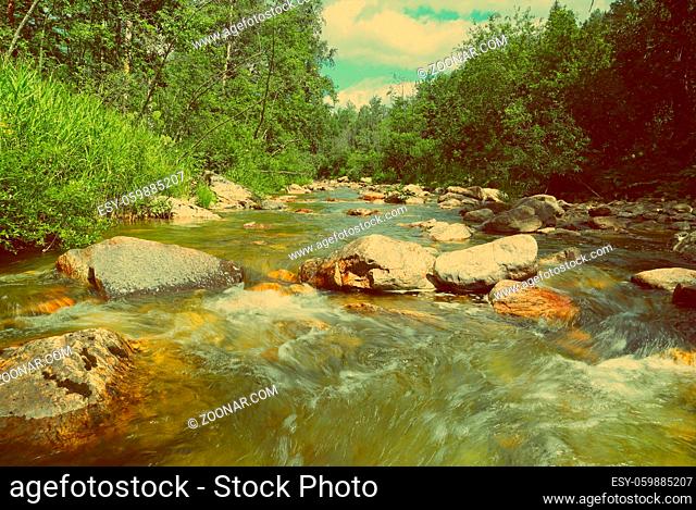 landscape with mountain river flowing over rocks at summer - vintage retro style