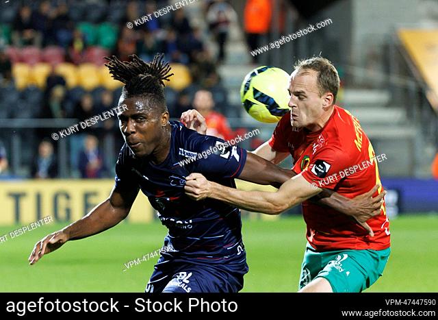 Essevee's Offor Chinonso and Oostende's Brecht Capon fight for the ball during a soccer match between KV Oostende and Zulte Waregem