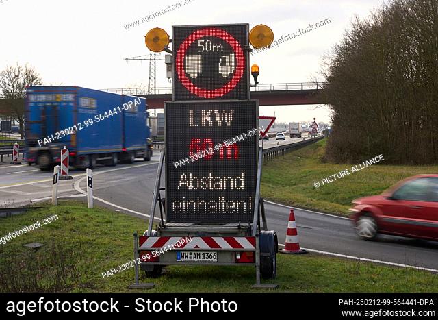 PRODUCTION - 06 February 2023, Rhineland-Palatinate, Winningen: Signs indicate bridge damage in front of the Moselle Valley Bridge on the A61 highway