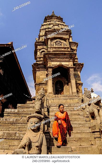 Young Woman Sitting on Stairs of Siddhi Laxmi Temple in Durbar Square, Bhaktapur, Bagmati Zone, Nepal