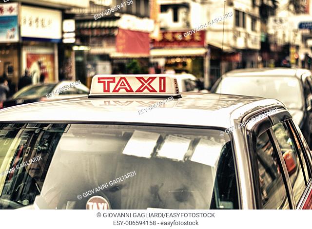 HONG KONG - APRIL 12: Taxis on the street on April 12, 2014 in Hong Kong. Over 90% daily travelers use public transport. Its the highest rank in the world