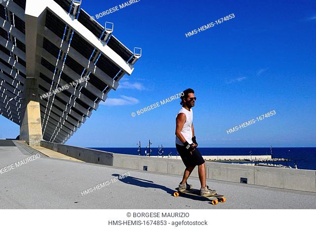 Spain, Catalonia, Barcelona, the Forum park, a skateboarder near the pergola fotovoltaica, giant solar panel designed by the architects Elias Torres and Jose...