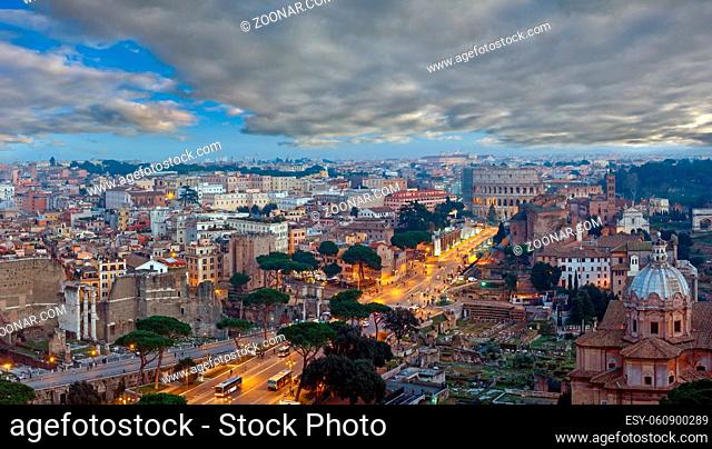 Ruins of Roman Forum. Rome City evening view from II Vittoriano top, Italy. People are unrecognizable. Multi shots stitch panorama
