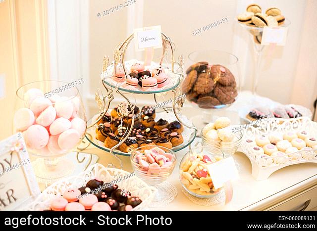 Candy bar. Banquet table full of desserts and an assortment of sweets. pie and cake. wedding or even