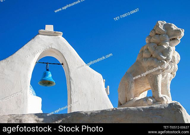 Greece, Cyclades Islands, Mykonos, Chora, Bell tower and lion statue of Paraportiani Orthodox Church