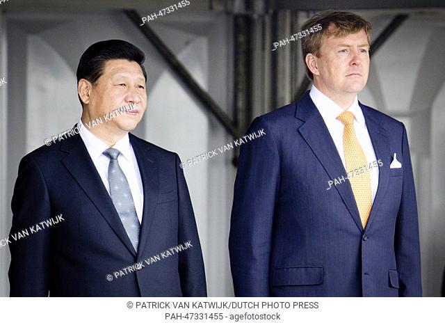 King Willem-Alexander of the Netherlands welcomes Chinese President Xi Jinping at the airport of Schiphol, Amsterdam, The Netherlands, 22 March 2014