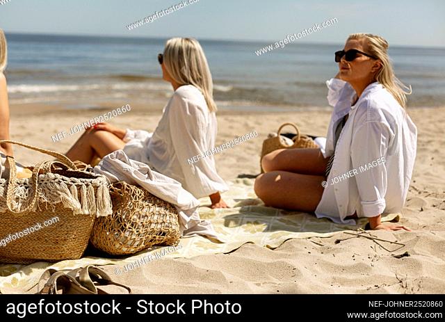 Women relaxing on beach