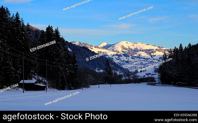 Winter morning scene in the Saanenland valley, Switzerland