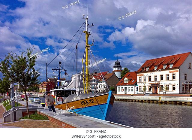 view on town with old ships at the pier of river Uecker river, Germany, Mecklenburg-Western Pomerania, Ueckermuende